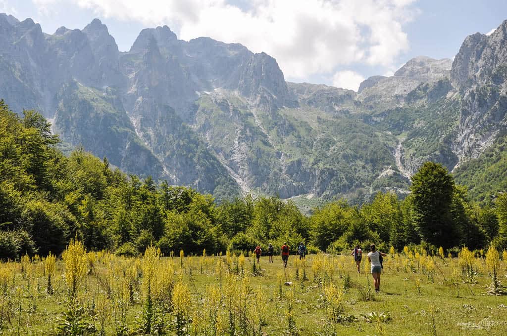 Peaks of the Balkans Tour Group of hikers in front of high peaks